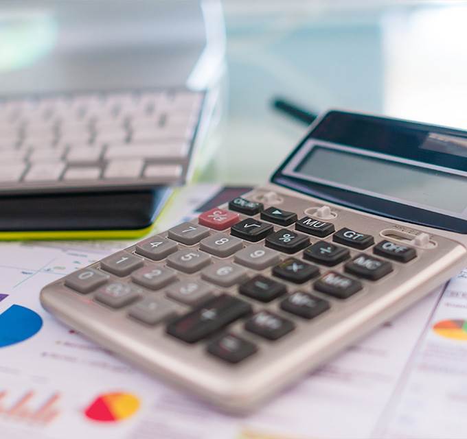 A calculator sitting on top of a desk